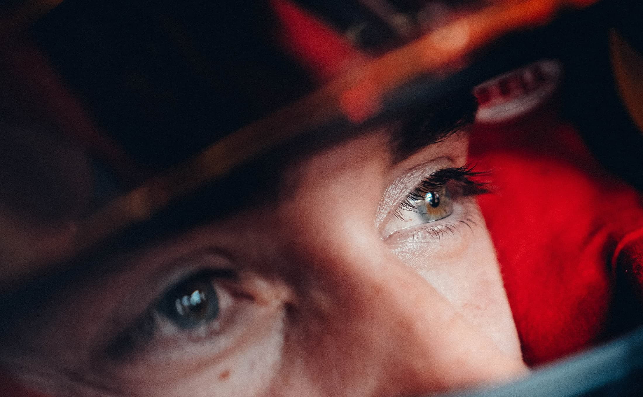 Close-up portrait lit in red